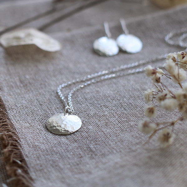Silver hammered disc earrings