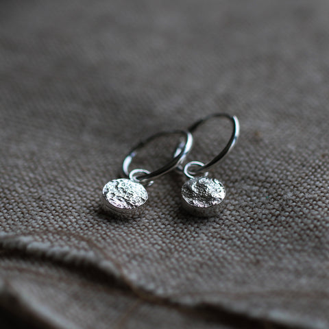 Huggie hoop earrings with solid stone texture charm