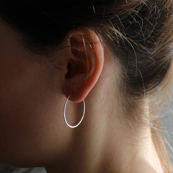 Thin silver hoop earrings