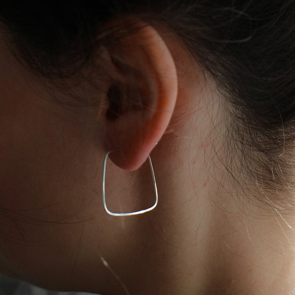 square hoop earring on model