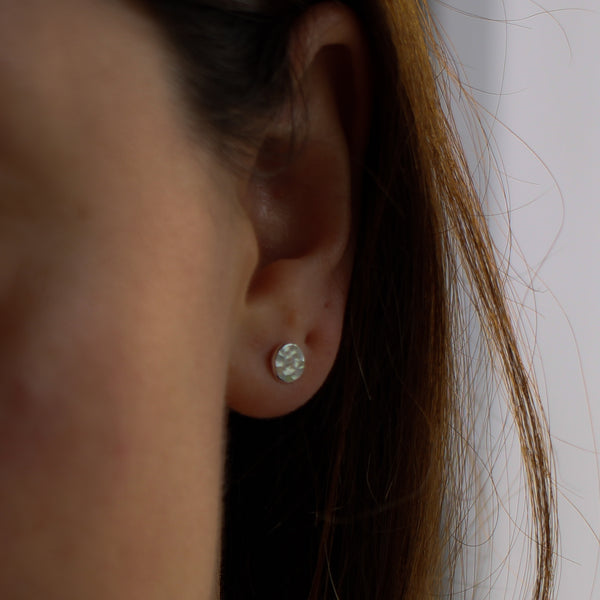 little hammered silver stud earrings on model